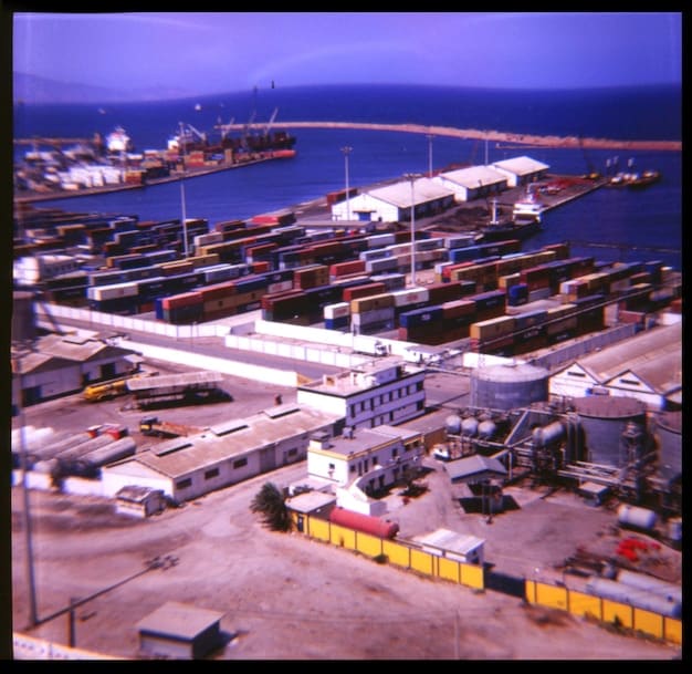 A photo illustrating congested ports with ships waiting to unload cargo, symbolizing the ongoing supply chain disruptions.