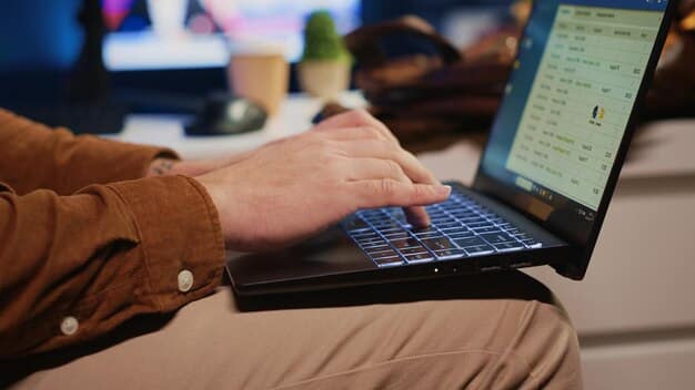 A close-up of a person typing on a laptop. The screen shows code or data, suggesting the need for digital skills in the modern workforce. The person's hands are blurred, conveying a sense of urgency and the fast-paced nature of the job market.